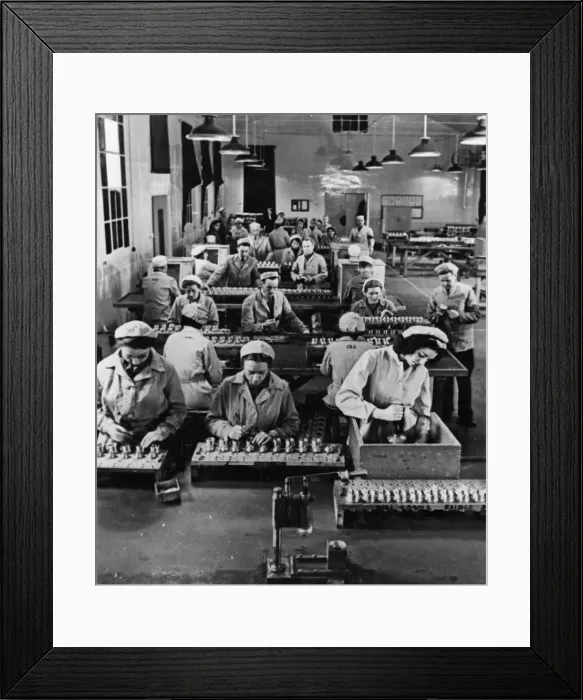 Framed Print : In a bright, airy shop in a Ministry of Supply factory, fuses are assembled by girls Framed Print : In a bright, airy shop in a Ministry of Supply factory, fuses are assembled by girls