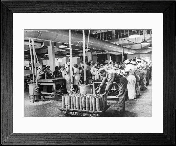Framed Print : In a Ministry of Supply filling factory, shells are cleaned up after the explosive has Framed Print : In a Ministry of Supply filling factory, shells are cleaned up after the explosive has