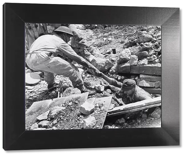 German caught at Piedimonte Matese, pulled from rubble. 6th June 1944