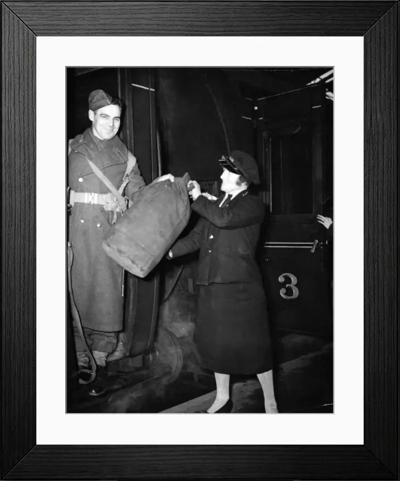 Framed Print : A woman railway porter at work during World War II. Circa 1941 Framed Print : A woman railway porter at work during World War II. Circa 1941