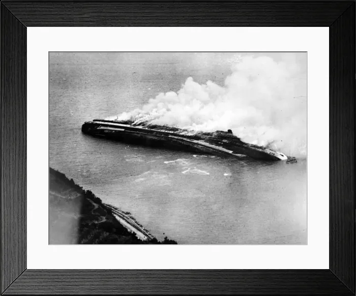 Framed Print : The Italian liner Rex lies on her side blazing after being destroyed by Allied bombers Framed Print : The Italian liner Rex lies on her side blazing after being destroyed by Allied bombers