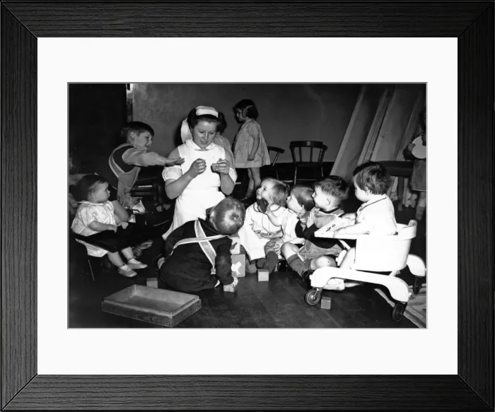 Framed Print : Children in nursery while their mothers work during World War II. Circa 1941 Framed Print : Children in nursery while their mothers work during World War II. Circa 1941