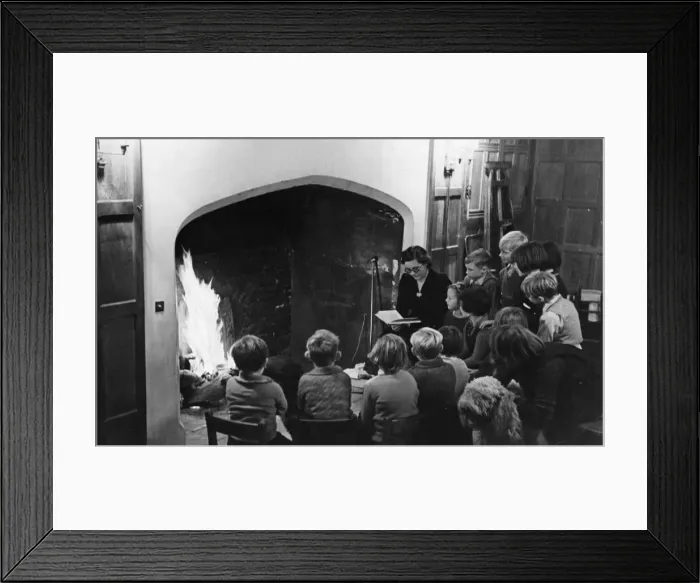 Framed Print : By the inglenook fire of an old English mansion, these happy evacuee children from a Framed Print : By the inglenook fire of an old English mansion, these happy evacuee children from a
