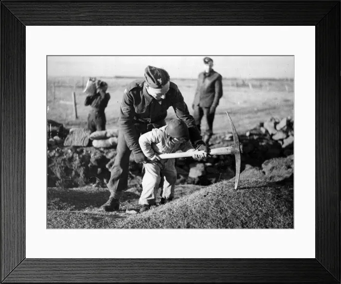 Framed Print : British troops in Iceland. A young child helping a soldier pickaxe the ground. Circa 1941 Framed Print : British troops in Iceland. A young child helping a soldier pickaxe the ground. Circa 1941