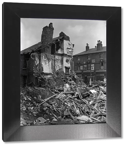 A house in Aston, Birmingham, collapsed after the building received a direct hit during