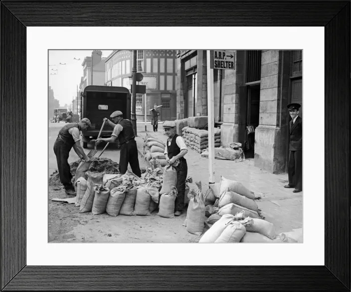 Framed Print : Corporation workmen filling and place sandbags to protect civic building from bomb blast Framed Print : Corporation workmen filling and place sandbags to protect civic building from bomb blast