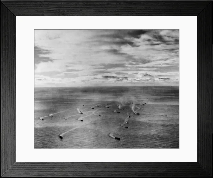 Framed Print : A setting sun dapples the clouds and streaks the waters of the Atlantic Ocean as one more
