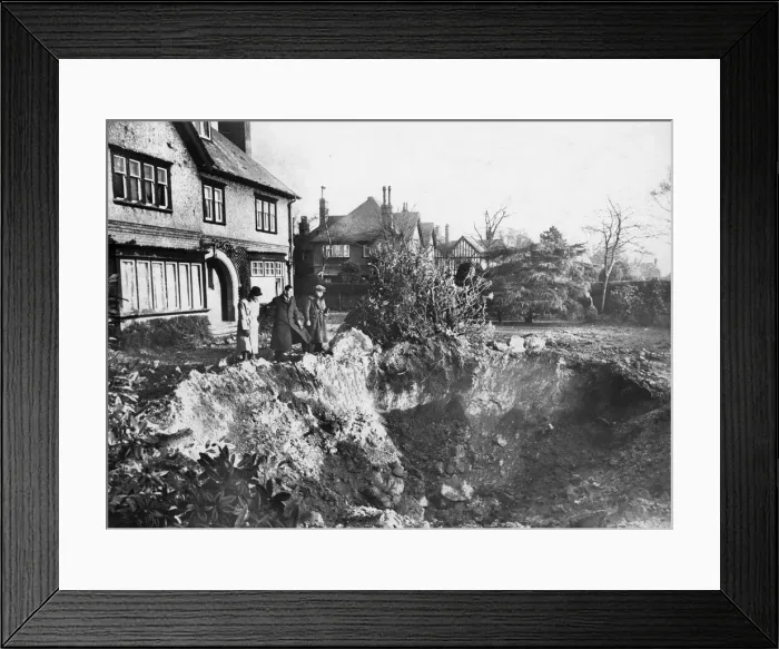 Framed Print : Vyner Road South, Birkenhead, Merseyside. A huge crater in the garden after an air