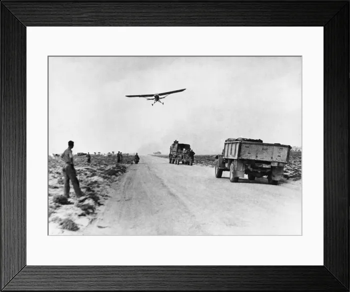 Framed Print : El Hamma road serves as impromptu airfield. A Stimson aircraft takes off from the road Framed Print : El Hamma road serves as impromptu airfield. A Stimson aircraft takes off from the road