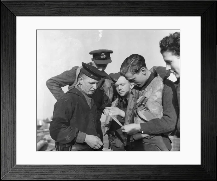 Framed Print : The Royal Air Force in Russia. The Wing of fighter Command seen examining a knife Framed Print : The Royal Air Force in Russia. The Wing of fighter Command seen examining a knife
