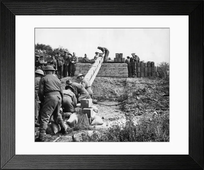 Framed Print : The Pioneer Corps handling tins and drums of petrol and oil using a human chain