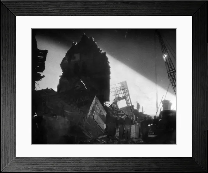 Framed Print : Night rescue by searchlight after a V Bomb in South England recently. December 1944
