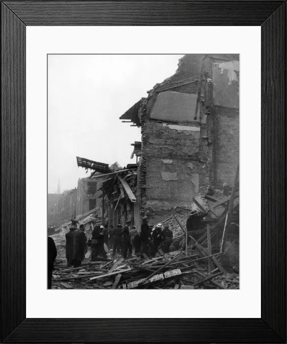 Framed Print : Aftermath of a V-bomb in Southern England. Rescue work going on in a smother of dust