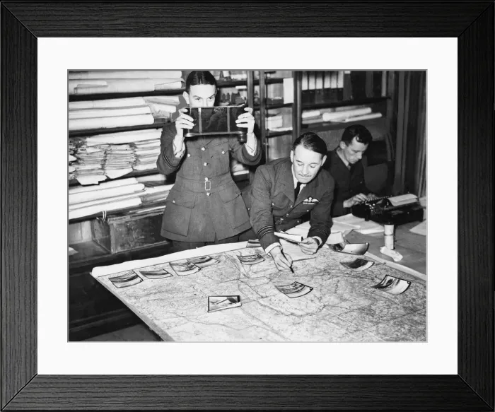 Framed Print : Reconnaissance photographs being assessed at an R. A. F. headquarters Framed Print : Reconnaissance photographs being assessed at an R. A. F. headquarters