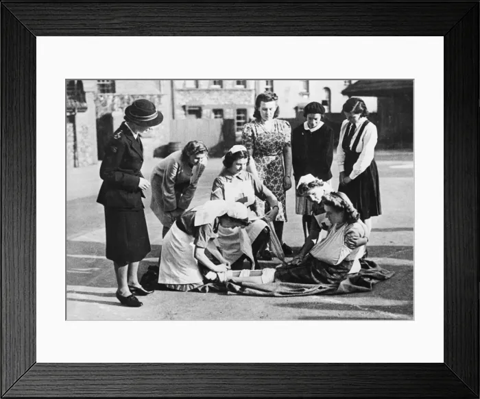 Framed Print : A Red Cross youth group training at Fairfield Grammar school in Bristol Framed Print : A Red Cross youth group training at Fairfield Grammar school in Bristol
