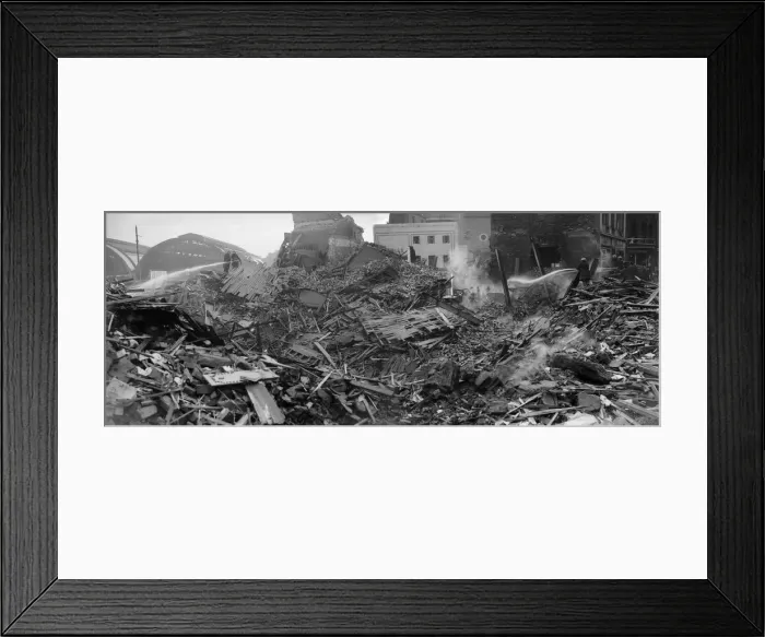 Framed Print : Firemen dampen down the shattered remains of John Bright Street, Birmingham