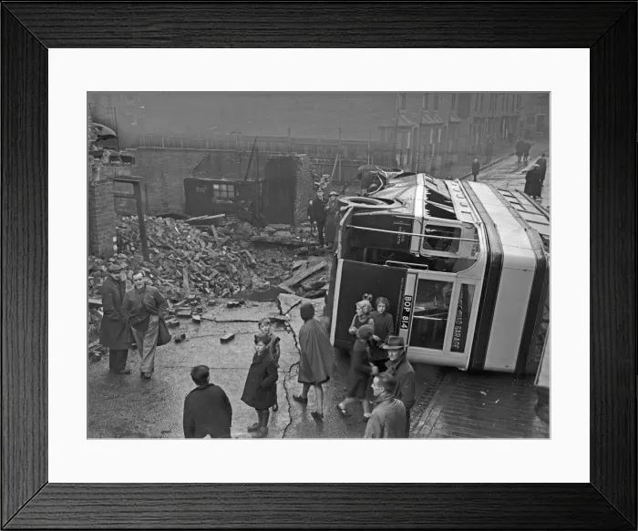 Framed Print : A bus on its side after being caught in the blast of a bomb in Sparkbrook Framed Print : A bus on its side after being caught in the blast of a bomb in Sparkbrook