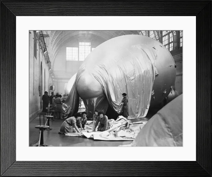 Framed Print : A barrage balloon is a large unmanned tethered kite balloon used to defend ground targets Framed Print : A barrage balloon is a large unmanned tethered kite balloon used to defend ground targets