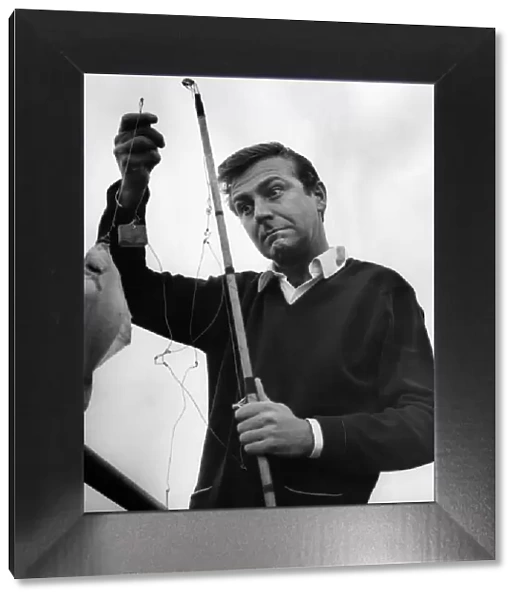 Des O Connor fishing off Blackpools North Pier. August 1966