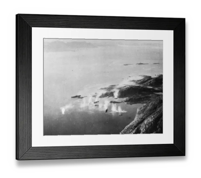Framed Print : Looking down on Lodingen Harbour, Norway as (left) a tanker receives a direct hit Framed Print : Looking down on Lodingen Harbour, Norway as (left) a tanker receives a direct hit