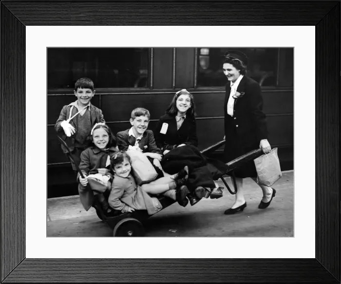 Framed Print : Mrs Reynolds, a ticket collector, and the mother of two evacuated children herself