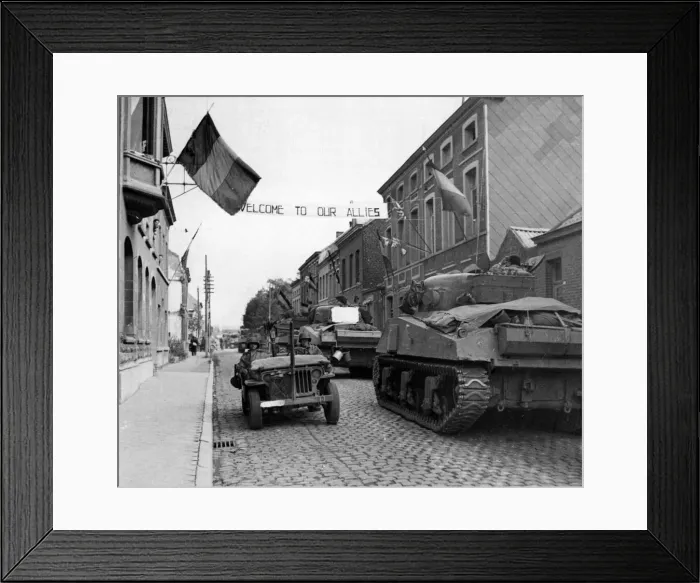 Framed Print : British advance in Belgium. A banner across a road in Antoing reads Framed Print : British advance in Belgium. A banner across a road in Antoing reads