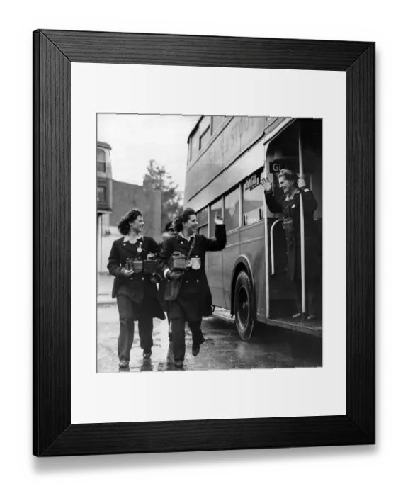 Framed Print : Women in mens jobs during World War Two. Bus conductor Mrs Margaret Leonard waves to her