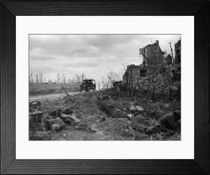 Framed Print : A jeep passes British and Canadian troops after the capture of Caen. 9th July 1944 Framed Print : A jeep passes British and Canadian troops after the capture of Caen. 9th July 1944