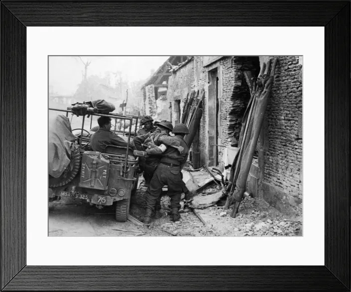 Framed Print : Wounded being loaded into jeeps during the capture of Caen. 9th July 1944 Framed Print : Wounded being loaded into jeeps during the capture of Caen. 9th July 1944