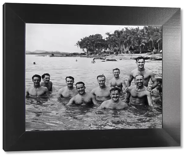 Members of the Royal Australian Air Force enjoy a dip in the cool sea waters as a