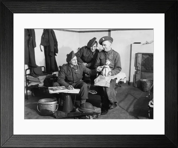 Framed Print : Fusilier F. Walsh of Grosvenor Avenue, London packs a doll which he bought in Brussels Framed Print : Fusilier F. Walsh of Grosvenor Avenue, London packs a doll which he bought in Brussels