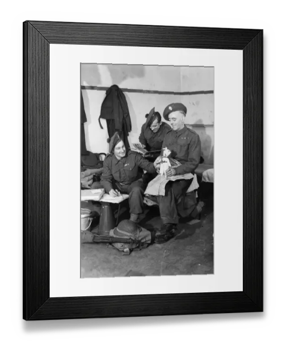 Framed Print : Fusilier F. Walsh of Grosvenor Avenue, London packs a doll which he bought in Brussels Framed Print : Fusilier F. Walsh of Grosvenor Avenue, London packs a doll which he bought in Brussels