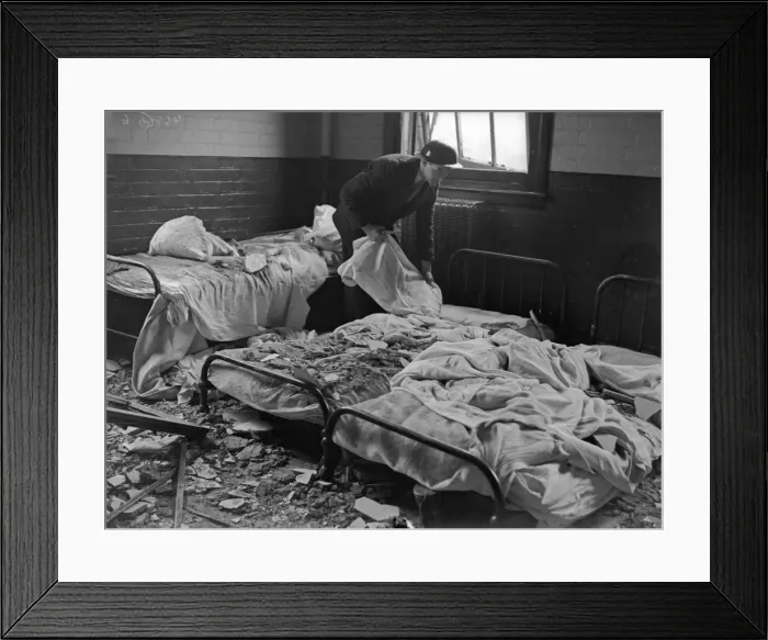 Framed Print : A warden searches the damaged wards of Erdington House hospital following a raid Framed Print : A warden searches the damaged wards of Erdington House hospital following a raid