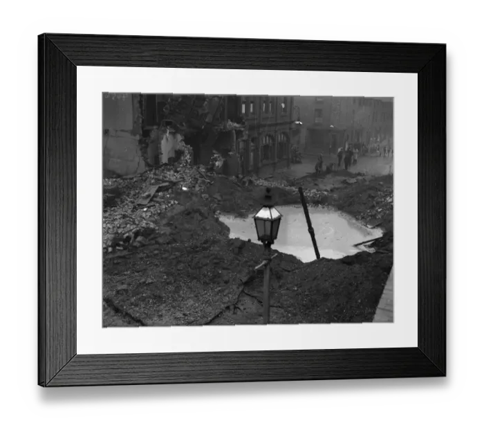 Framed Print : Residents gather around a water filled crater outside a public house in Newtown Row Framed Print : Residents gather around a water filled crater outside a public house in Newtown Row
