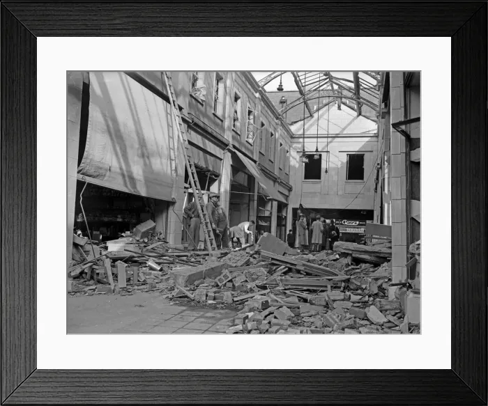 Framed Print : Workmen inspect the damage to The Arcade in Coventry following a raid on the city Framed Print : Workmen inspect the damage to The Arcade in Coventry following a raid on the city