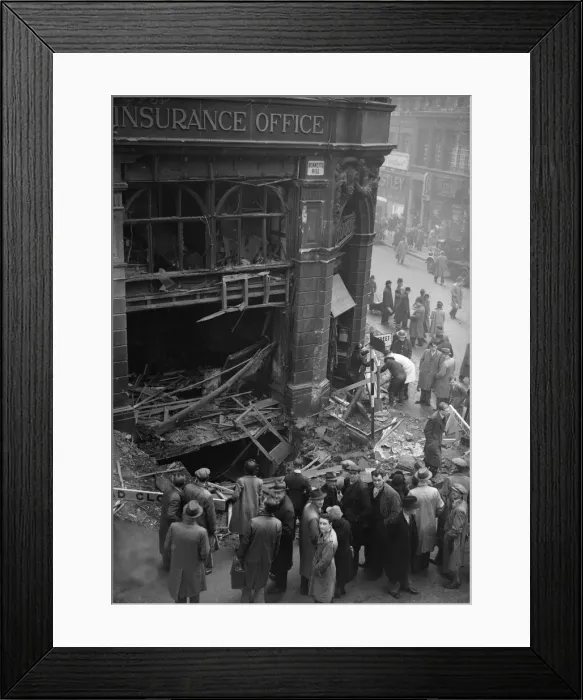 Framed Print : Birmingham residents inspect a bomb crater at the corner of Bennetts Hill and New Street