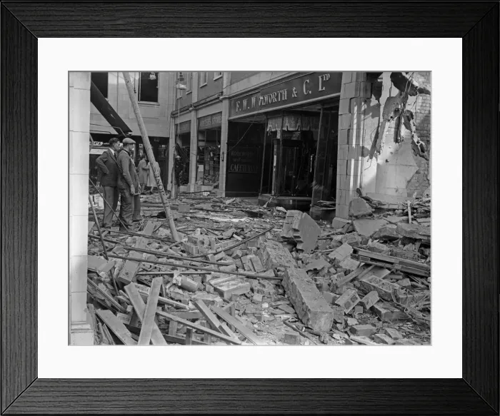Framed Print : Workmen inspect the damage to F W Woolworth and The Arcade in Coventry following a raid Framed Print : Workmen inspect the damage to F W Woolworth and The Arcade in Coventry following a raid
