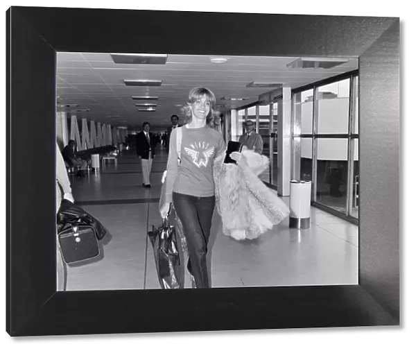 Olivia Newton John leaving Heathrow Airport for Los Angeles. 9th June 1977