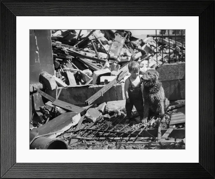 Framed Print : Three year old Freddy Arnold stands amongst the ruins of his bomb shattered home in Bath