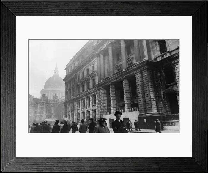 Framed Print : Commuters pass the burnt out shell of the Central Telegraph Office on the corner of Framed Print : Commuters pass the burnt out shell of the Central Telegraph Office on the corner of