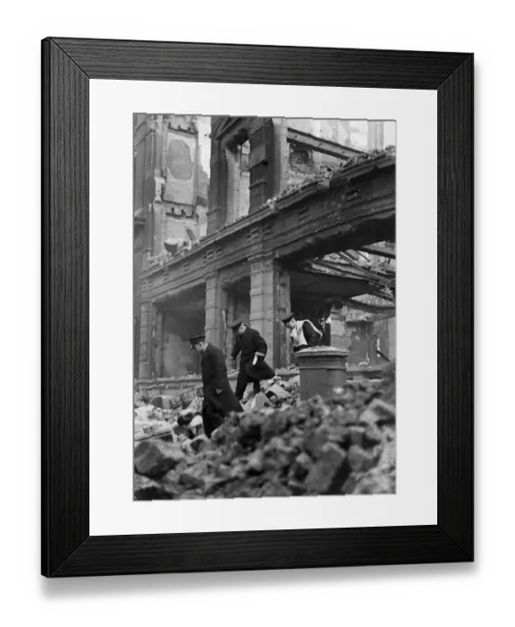 Framed Print : Postmen shift through the wreckage and rubble to retrieve letters from a blitzed post box