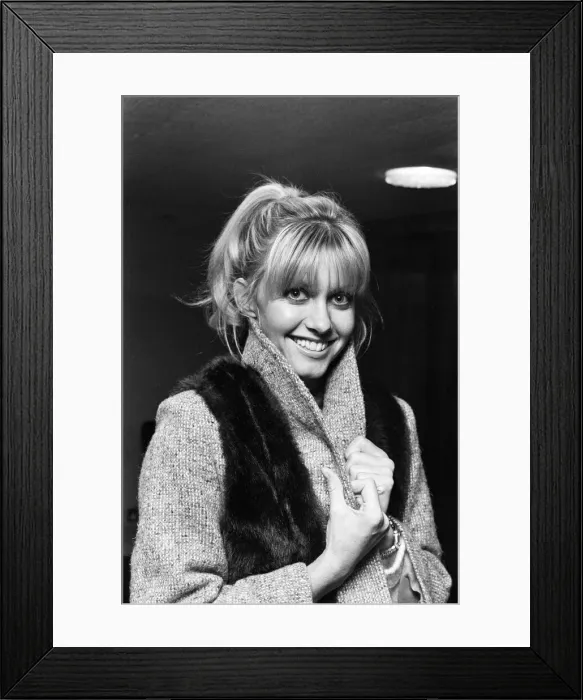 Framed Print : Singer and actress Olivia Newton John at Luton Airport. 28th November 1978