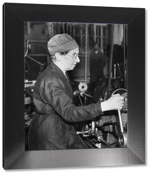Factory worker Mrs C Kyle at work in a Birmingham munitions factory during the Second