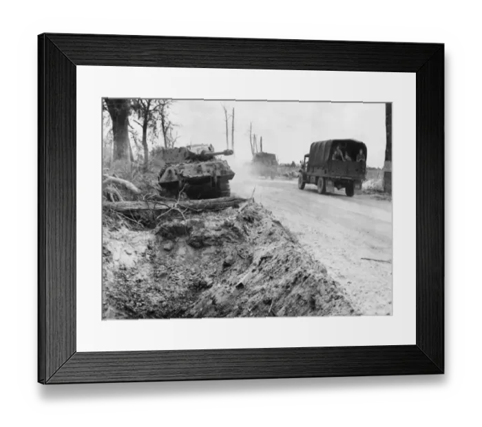 Framed Print : An advancing Allied column passing a damaged German Panther tank on the Falaise road
