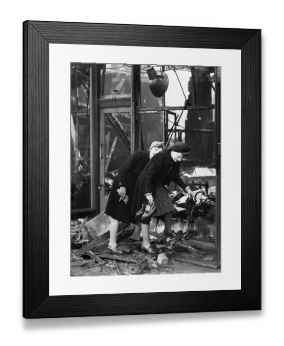 Framed Print : Two women salvaging the stock after their shop had been burnt out buy incendiary bombs Framed Print : Two women salvaging the stock after their shop had been burnt out buy incendiary bombs