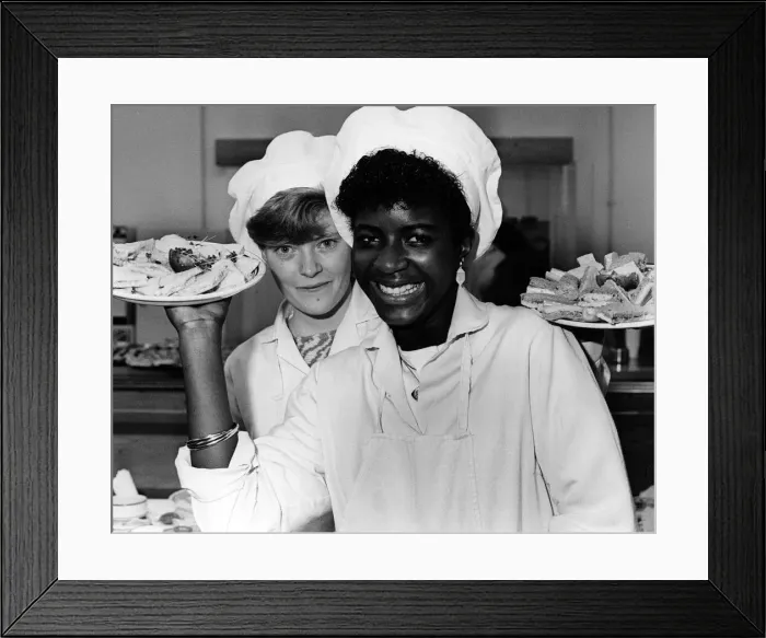 Framed Print : As Good as New'Shops in Coventry. Canteen trainees Yvonne (left