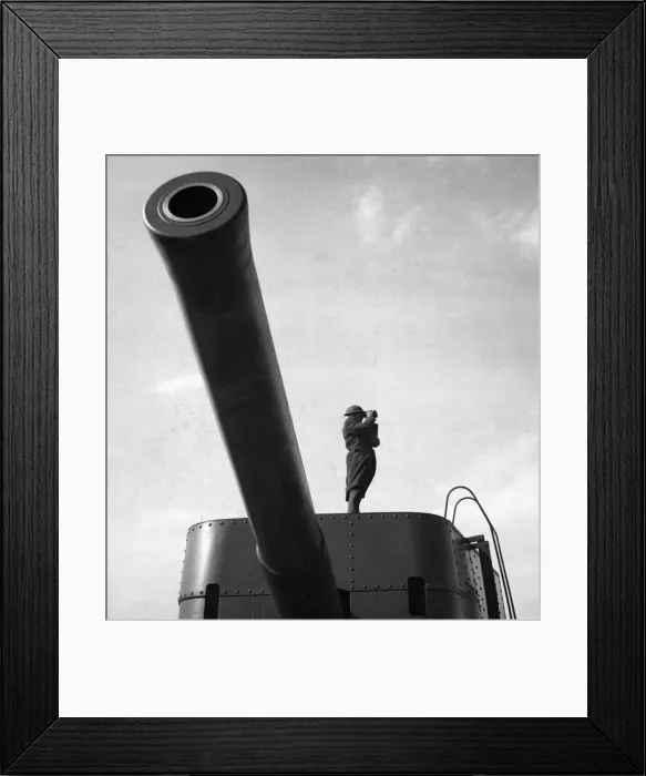 Framed Print : A lookout standing on a 9. 2 coastal defence gun on the east coast of Scotland Framed Print : A lookout standing on a 9. 2 coastal defence gun on the east coast of Scotland