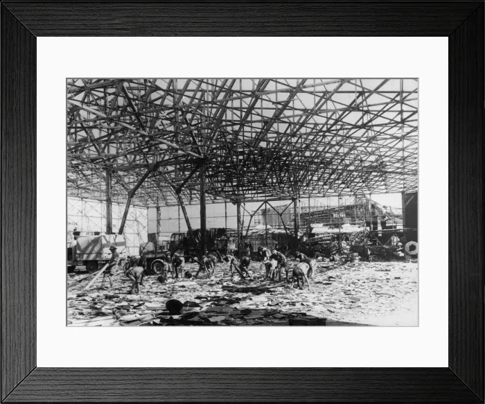 Framed Print : RAF ground crew clear up wreckage inside a bomb shattered hangar at an airport near Framed Print : RAF ground crew clear up wreckage inside a bomb shattered hangar at an airport near