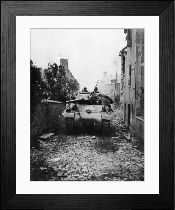 Framed Print : An American M-10 tank destroyer of the US Army rambles along a debris strewn road near