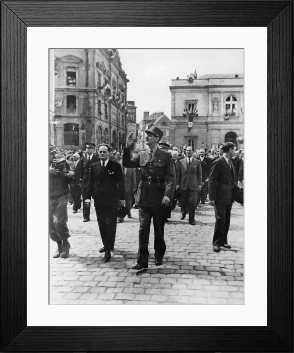 Framed Print : General De Gaulle waves to the wildly cheering crowds of his countrymen as he Framed Print : General De Gaulle waves to the wildly cheering crowds of his countrymen as he
